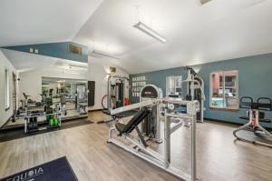 a gym with treadmills and machines in a room at Blueground Campbell pool nr Campbell Park SFO-1998 in Campbell