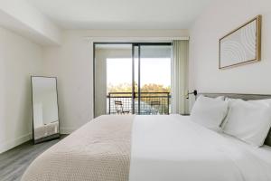 Ένα ή περισσότερα κρεβάτια σε δωμάτιο στο Blueground Diridon pool nr San Jose Museum SFO-2089