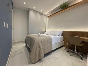 a hospital room with a bed and a desk at Tupis Flats 1401 in Belo Horizonte +29 photos