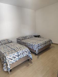 Ένα ή περισσότερα κρεβάτια σε δωμάτιο στο Pousada Esspaço Vista Mar