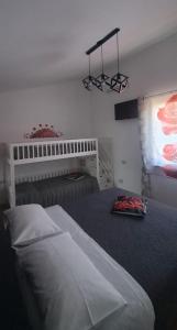 Postel nebo postele na pokoji v ubytování La rosa rossa + 5 fotografií