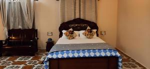 Postel nebo postele na pokoji v ubytování ET's Casa de la Abuela + 5 fotografií