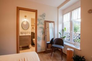 Ένα ή περισσότερα κρεβάτια σε δωμάτιο στο Le Jardin Secret