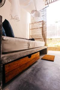 Postel nebo postele na pokoji v ubytování Malkoha Studios + 8 fotografií