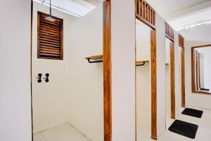 a hallway of a house with a door and a window at Malkoha Studios in Dickwella