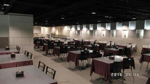 a large room with tables and chairs and tablesktop at Walker Hotel - Zhengyi in Taipei