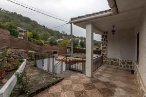 a balcony of a house with a table on it at El Salón de Arriba in El Real de San Vicente +41 photos