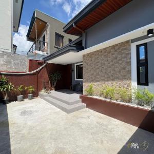a courtyard of a house with stairs and plants at CJ Apartments-III in Olongapo +37 photos