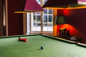 a pool table with a ball on it in a room at The Citadel in Weston