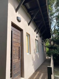 a door on the side of a house at Cabañas Cruz del Sur in Miramar +8 photos