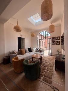a living room with a couch and a table at Villa Cannella in Najem