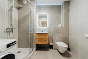 Koupelna v ubytování Apartamenty Dominikańska + 77 fotografií