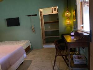 Μια τηλεόραση ή/και κέντρο ψυχαγωγίας στο Aldeia Patuá - chalés na Praia de Algodões