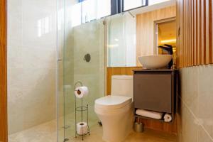 a bathroom with a toilet and a sink at Del Mar City View in Cartagena de Indias +41 photos