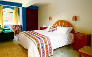 Ένα ή περισσότερα κρεβάτια σε δωμάτιο στο CasaDePaz Samay Wasi