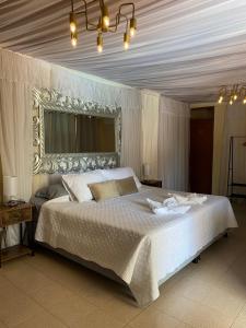 Postel nebo postele na pokoji v ubytování Valle Suites, la mejor zona