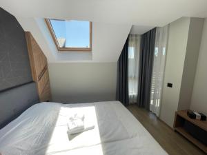 Ένα ή περισσότερα κρεβάτια σε δωμάτιο στο Escape Panorama Apartmani Tara