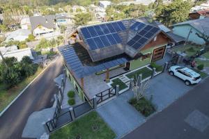 an overhead view of a house with solar panels on it at Casa Petri Gramado in Gramado