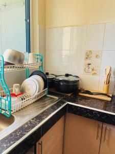 Kuchyň nebo kuchyňský kout v ubytování Coastal Bliss 2BR Beach Getaway in Kanamai, Mtwapa + 10 fotografií