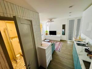a room with a kitchen with a counter top at AMBER APARTMENTS - SUNNY STUDIO in Morro del Jable