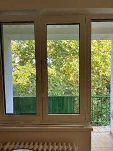 a window in a room with three windows at City-Centre appartment in Piešťany