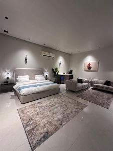 Ένα ή περισσότερα κρεβάτια σε δωμάτιο στο HA Suite