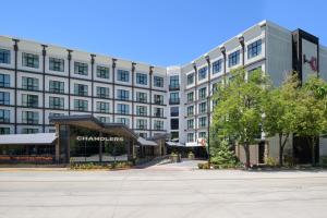 a large white building with a store in front of it at Hotel 43 Boise in Boise