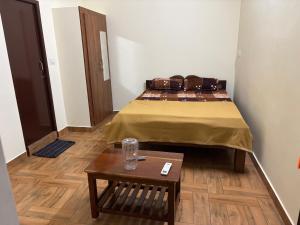 Ένα ή περισσότερα κρεβάτια σε δωμάτιο στο VRS Guest House