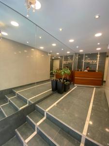 a lobby with stairs in a building at Appart Tucuman in Buenos Aires