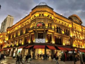 a large building with people walking in front of it at Appart Tucuman in Buenos Aires
