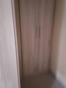 an empty room with a door in the corner at B vhonani in Polokwane