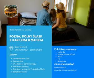 a man and woman sitting on a bed in a hotel room at Hotel Karczma u Macieja in Bolków