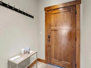 a wooden door in a room with a table at Nucleus 303 in Columbia Falls +18 photos