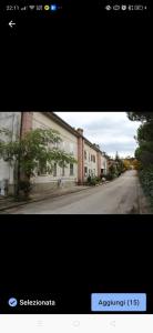a picture of an empty street with a building at La casetta del cacciatore 