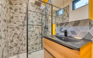 a bathroom with a sink and a shower at Le Hameau Paisible in Butot +28 photos