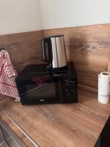 a coffee maker sitting on top of a counter at Diezer Apartment in Diez