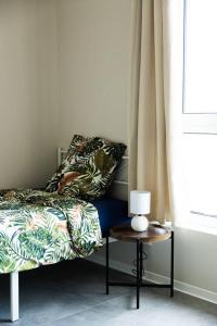 Ένα ή περισσότερα κρεβάτια σε δωμάτιο στο Maison MUGUET 1 SPA-PARKING-COLMAR