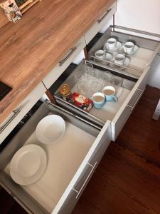 an open kitchen with plates and dishes in it at Diezer Apartment in Diez