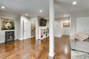 a living room with a bed and a fireplace at Stunning Alaskan Getaway with River and Mtn Views in Eagle River