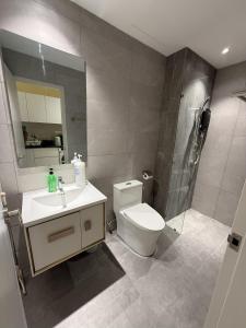 a bathroom with a toilet and a sink and a shower at Majestic Residance Luxury Suites By klcc in Gua Sai +45 photos