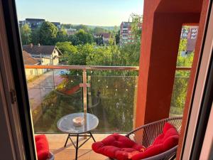 a view of a balcony with a table and chairs at Red room in Petrovac na Mlavi