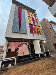 a building with colorful windows on the side of it at The Royal palace hotel in Phalodi