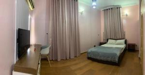 Voodi või voodid majutusasutuse Welcome to Ilé Amor - The House of Love! toas +7 fotot