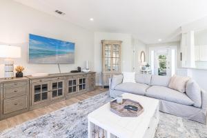 a living room with a couch and a tv at Turnberry 8561 in Destin