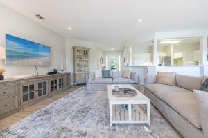 a living room with a couch and a table at Turnberry 8561 in Destin