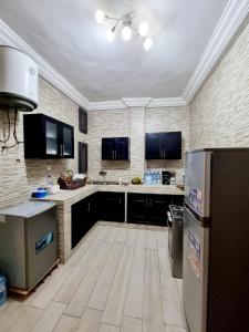 Kuchyň nebo kuchyňský kout v ubytování Appartmeublé , Cotonou