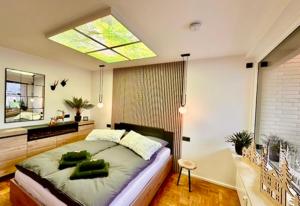 a bedroom with a large bed and a window at Ferienwohnung Harzurlaub II in Hahnenklee-Bockswiese