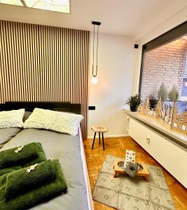 a bedroom with a bed and a window at Ferienwohnung Harzurlaub II in Hahnenklee-Bockswiese +43 photos
