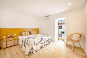 Postel nebo postele na pokoji v ubytování Vila Amorim - Stylish 4BR Home with Jacuzzi