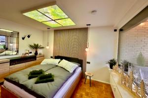 a bedroom with a large bed and a window at Ferienwohnung Harzurlaub II in Hahnenklee-Bockswiese